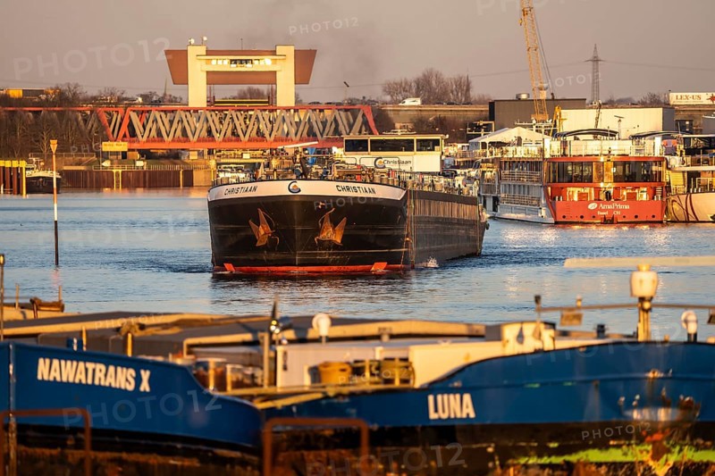 Barges, in the harbor canal in the port of Ruhrpott, have left the Meiderich canal lock, from the Rhine-Herne Canal and are heading for the Rhine, tanker Christiaan, Duisburg, North Rhine-Westphalia, Germany