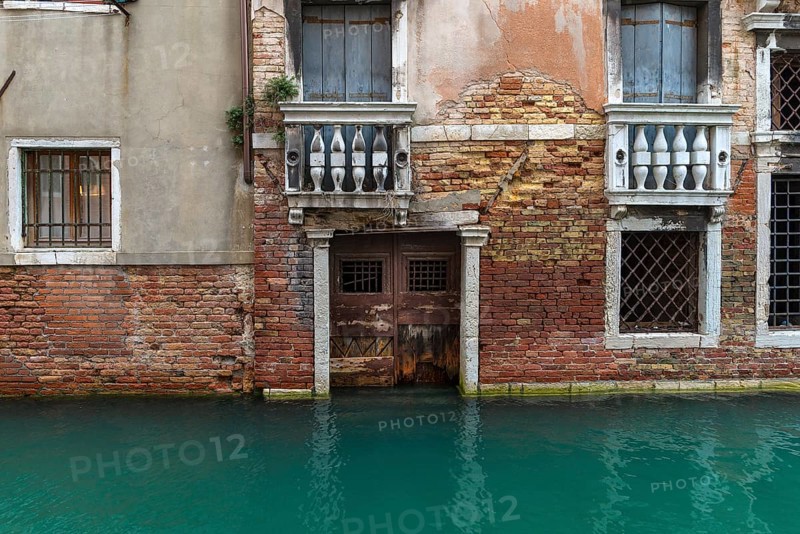 Detail of a house façade in the old town during high tide, Venice, Veneto, Italy