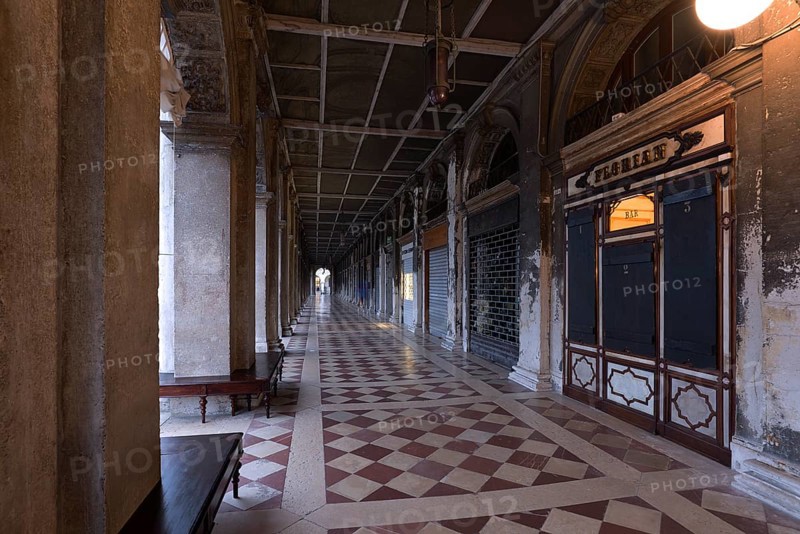 Empty arcades of the Old Procuration, 16th century, St. Mark's Square early in the morning Venice, Veneto, Italy