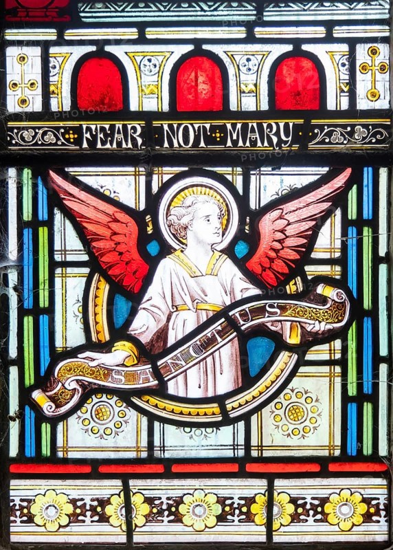 Details of stained glass window of an angel by Clayton and Bell, church of Saint James, Avebury, Wiltshire, England, UK