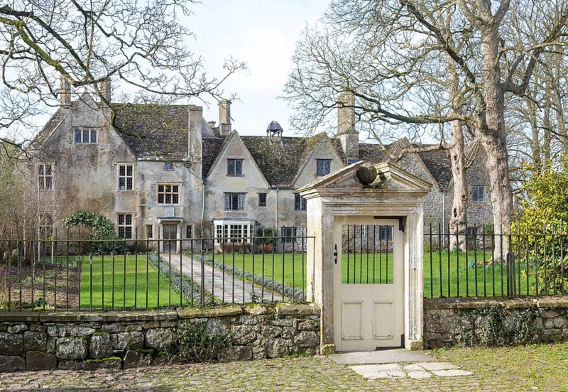 Railings and doorway of historic manor house building, Avebury Manor, Wiltshire, England, UK