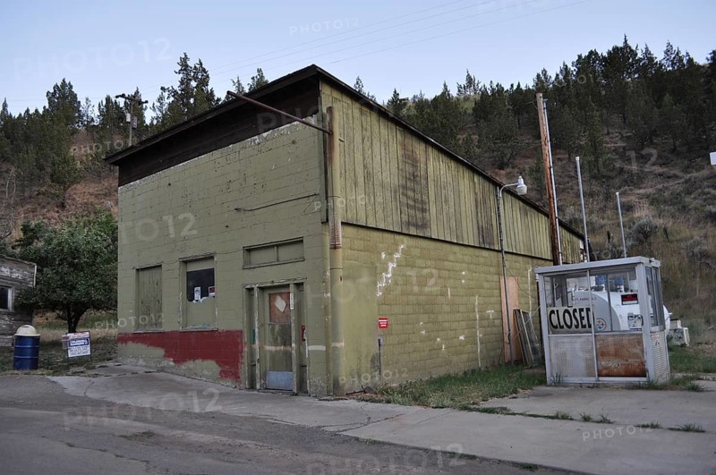 Old abandoned building with closed front door in a rural setting, Mitchell, Oregon, USA