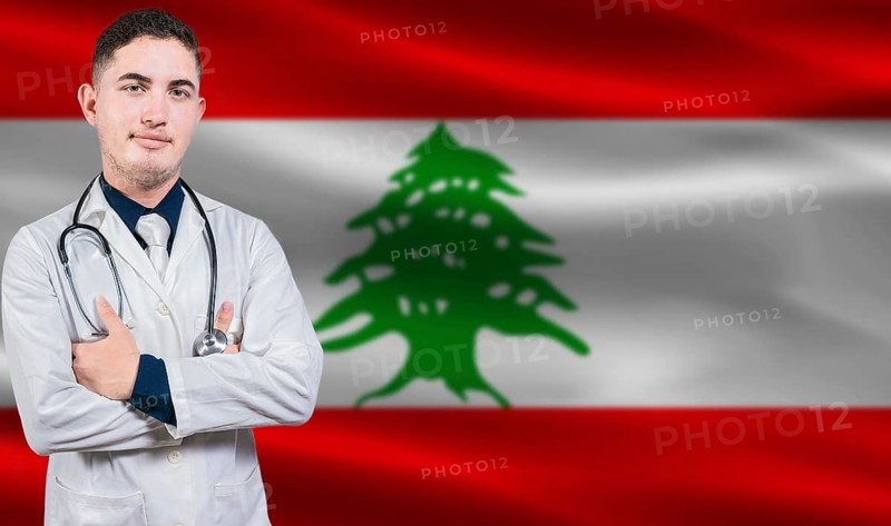 Portrait of medical professional on Lebanon flag background. Lebanese national health system