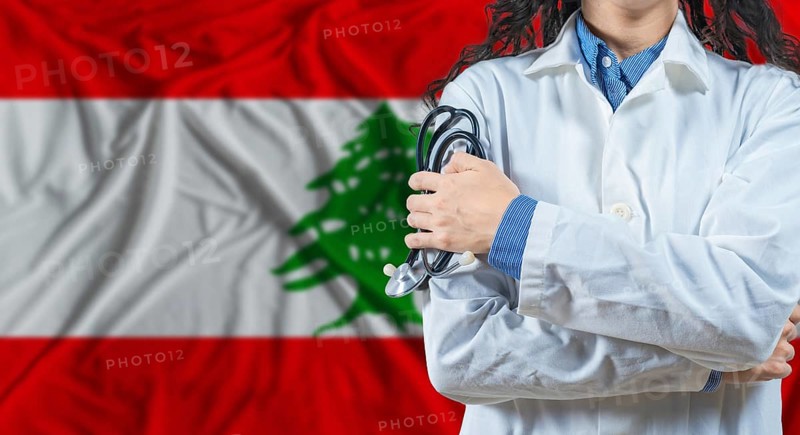 Healthcare professional with Lebanon flag background. Professional doctor holding stethoscope on Lebanon flag background