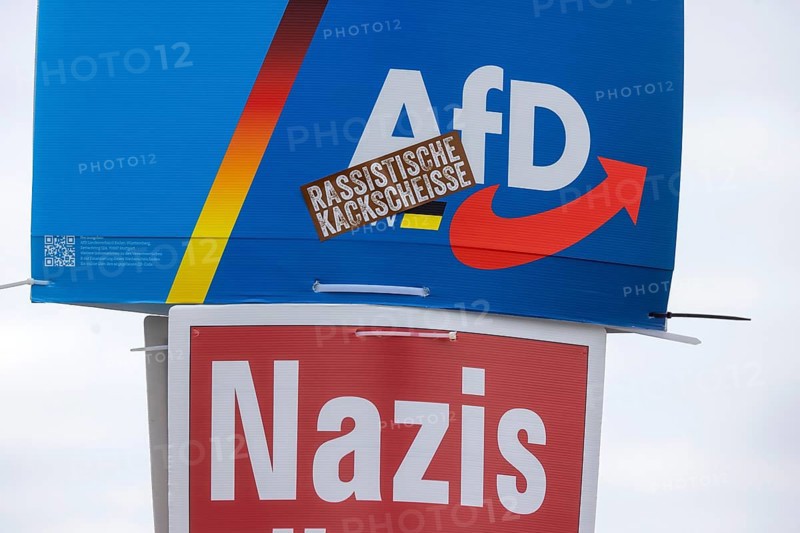 2026 state election in Baden-Württemberg. Election advertising in the city center of Stuttgart. Poster of the AfD party. Including a poster from THE PARTY THE PARTY with the slogan: Kill Nazis. Liver: Racist crap. Stuttgart, Baden-Württemberg, Germany