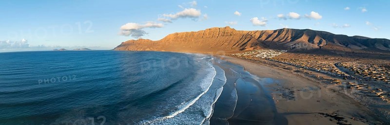 Panorama, Risco de Famara cliffs and sea with Famara beach, in the evening light, Playa de Famara, aerial view, Lanzarote, Canary Islands, Spain