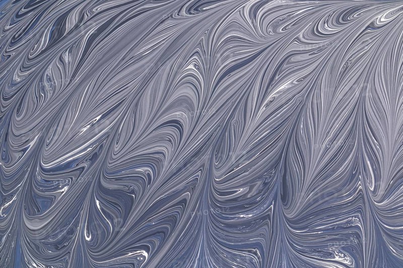 A captivating abstract design in grey and white, featuring elegant swirling patterns. This fluid texture resembles marble, adding a sophisticated touch to any project