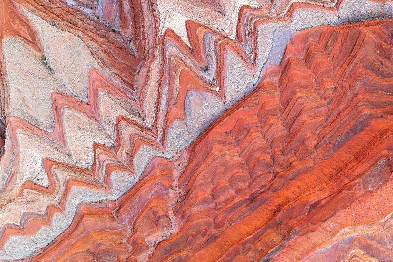 Captivating aerial image of the textured and winding canyons near the San Juan river in Utah, showcasing vivid geological formations