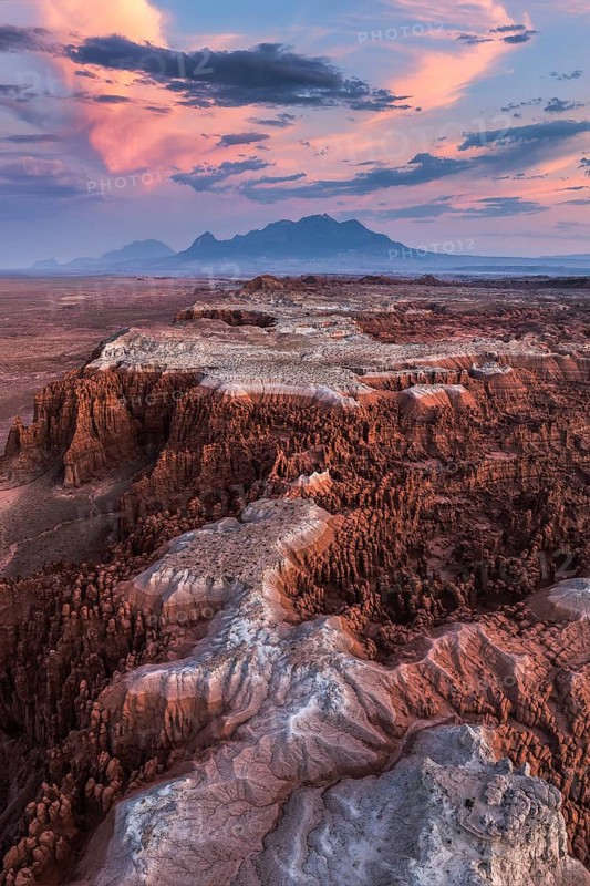 Striking aerial capture of Goblin Valley State Park in Utah, showcasing the rocky landscape bathed in the warm glow of sunset