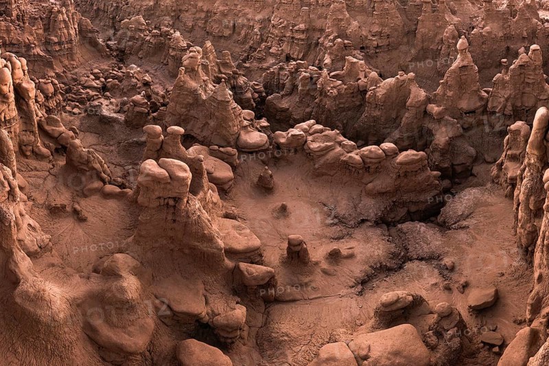 Aerial view of the bizarre and unique rock formations known as hoodoos in Goblin Valley State Park, Utah, displaying a captivating landscape of natural red rock artistry