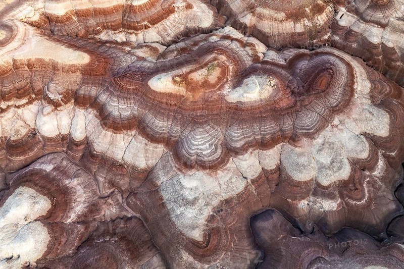 Aerial view highlights the intricate patterns and layers of bentonite-rich sandstone formations in Utah, USA, showcasing nature's artistry and geological wonders