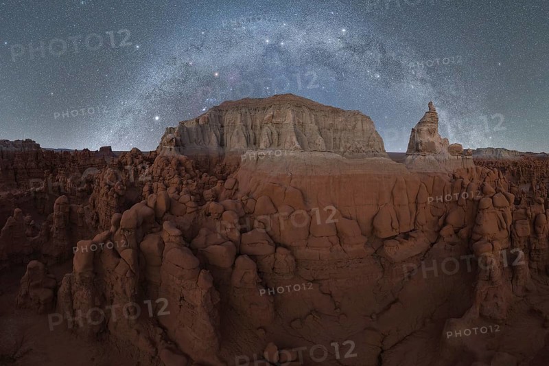Majestic night sky filled with stars and the Milky Way above the unique sandstone formations of Goblin Valley State Park, Utah
