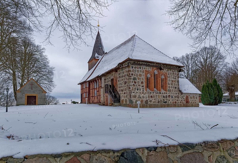 Lassahn village church in the snow in the Schaalsee UNESCO Biosphere Reserve. Lassahn, Mecklenburg-Western Pomerania, Germany