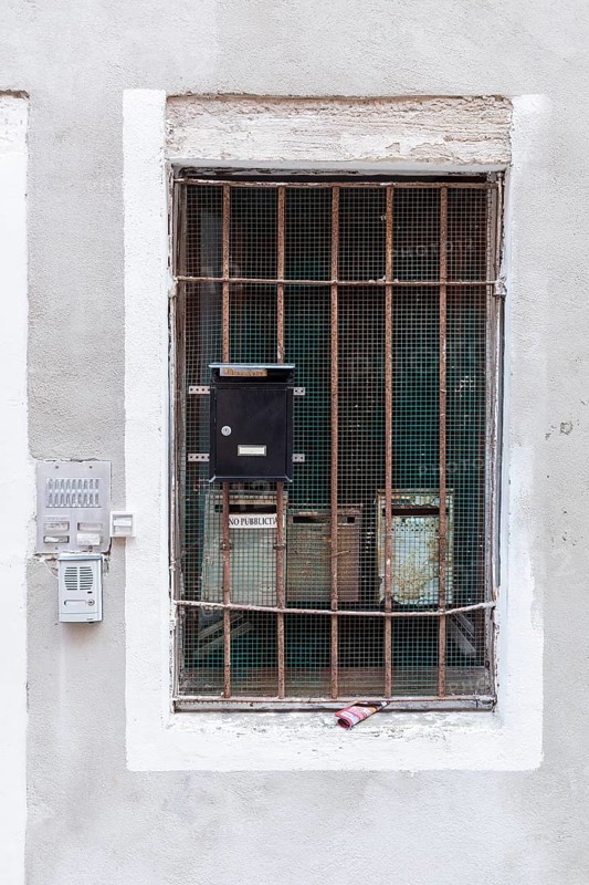 Mailboxes behind a latticed window, Venice, Veneto, Italy