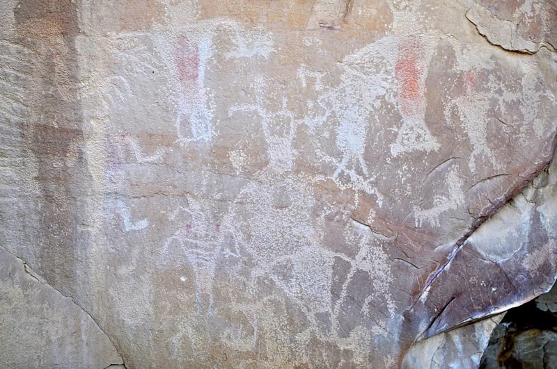 Abstracted figures and symbols as petroglyphs from the Fremont culture on a stone surface, Dinosaur National Monument, Utah, USA