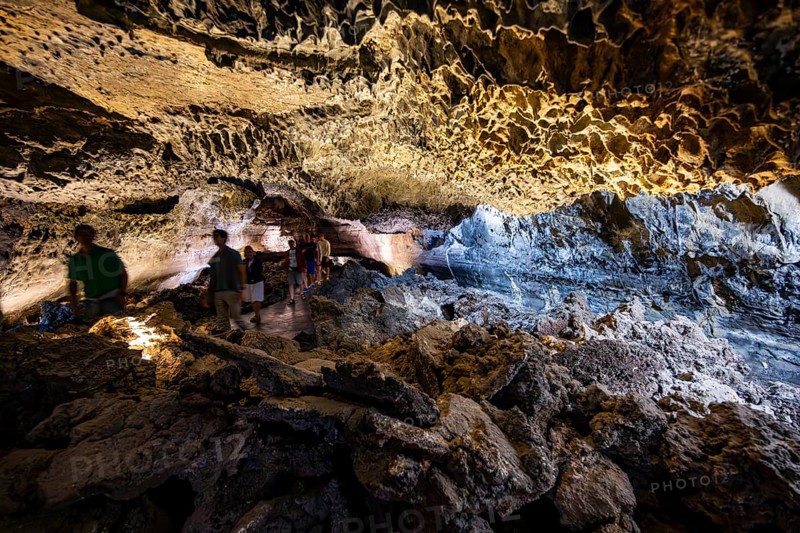 Underground cave formed by lava flow, visitors in illuminated lava cave, Cueva de los Verdes, Lanzarote, Canary Islands, Spain