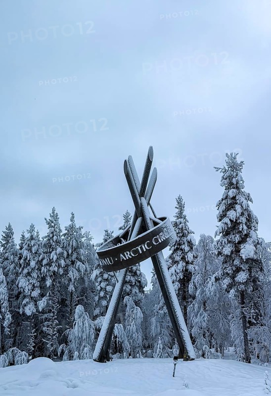 Monument on polar ice, snowy forest, Lapland, Finland