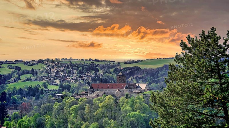 The fortress, Veste Rosenberg in Kronach in the light of a colorful, glowing sunset, Franconian Forest nature park Park