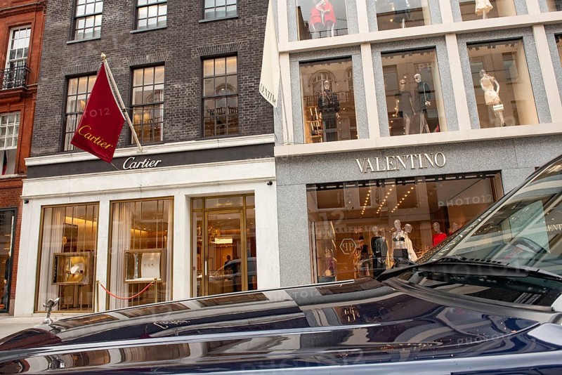 United Kingdom. August 2nd 2023 A Rolls Royce Bentley parked in front of Cartier and Valentino luxury brand stores in Old Bond Street, London