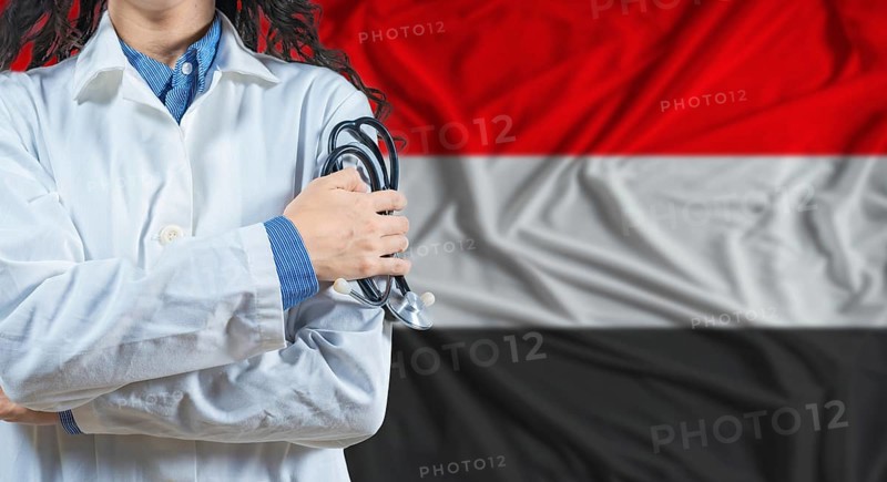 Healthcare professional with Yemen flag background. Professional doctor holding stethoscope on Yemen flag background