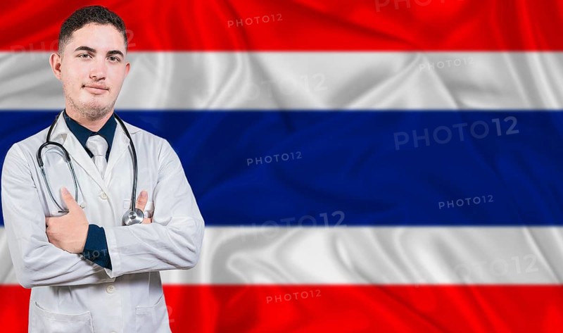 Portrait of medical professional on Thailand flag background. Thai national health system