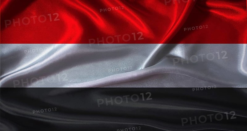 Yemen flag with cloth textured background. National flag of Yemen with realistic texture