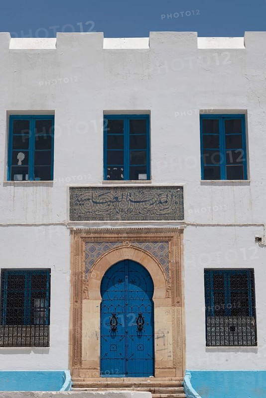 The beautiful blue ornate door and architecture of the Abbasid School inside the Medina of Sfax, Tunisia, North Africa