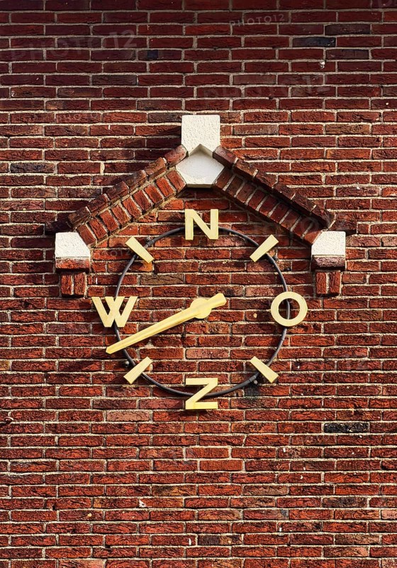 Wind clock on brick wall, Roermond, Limburg Province, Netherlands