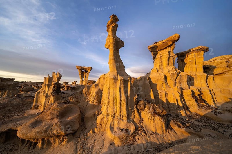 Stunning sandstone formations in Bisti De-Na-Zin Wilderness, New Mexico, captured at sunset These natural sculptures, shaped by wind and water, create a surreal desert landscape