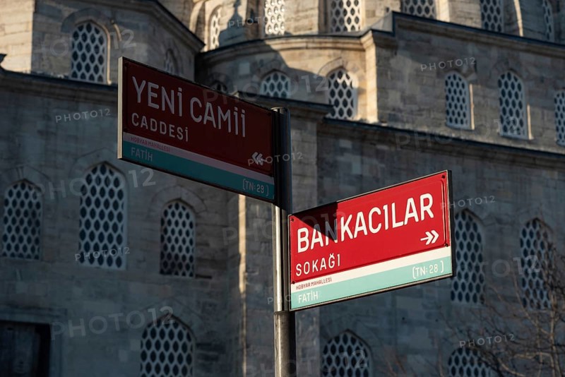 Street sign for Yeni Cami Caddesi and Bankacilar Sokagi behind the New Mosque in the Fatih district of the European side of Istanbul, Turkey