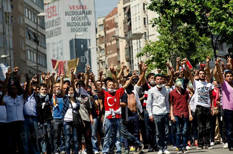 Istanbul, Turkey. June 1st 2013 Turkish protestors confront police with hand gestures during the Gezi Park demonstrations, Istanbul, Turkey