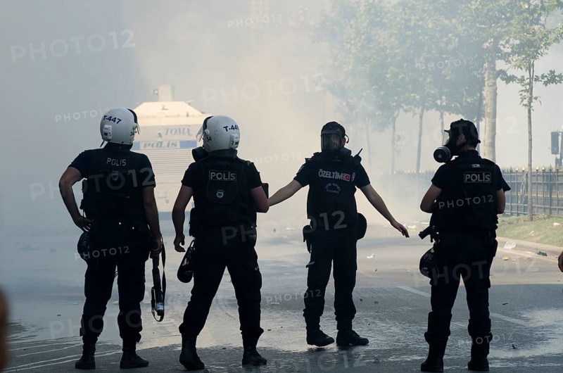 Istanbul, Turkey. June 1st 2013 Turkish riot police in clouds of tear gas, Gezi park, Taksim square, Istanbul, Turkey