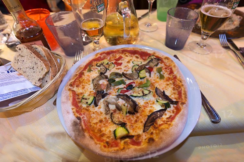 Vegetarian pizza in a restaurant, Italy