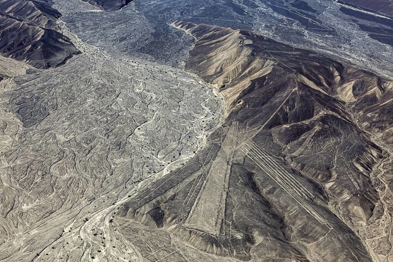 Wide mountain and desert area with recognizable Nazca lines in Peru, the geoglyphs and images in the desert near Nasca and Palpa in Peru