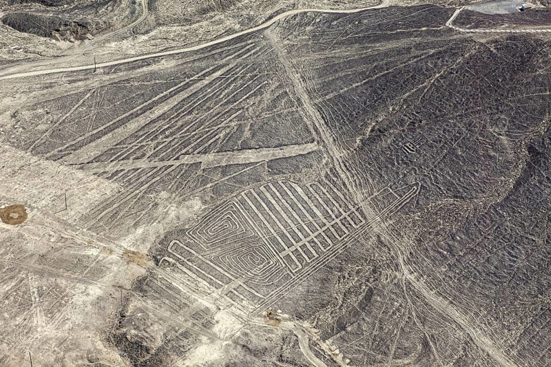 Desert plains with geometric Nazca lines photographed from the air in Peru, The geoglyphs and images in the desert near Nasca and Palpa in Peru