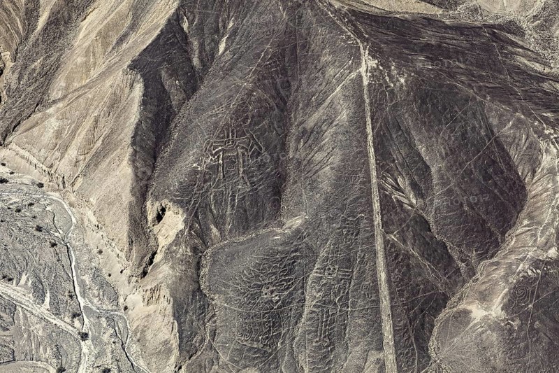 Image of the Nazca Lines showing historic geoglyphs on sandy hills, The geoglyphs and drawings in the desert near Nasca and Palpa in Peru