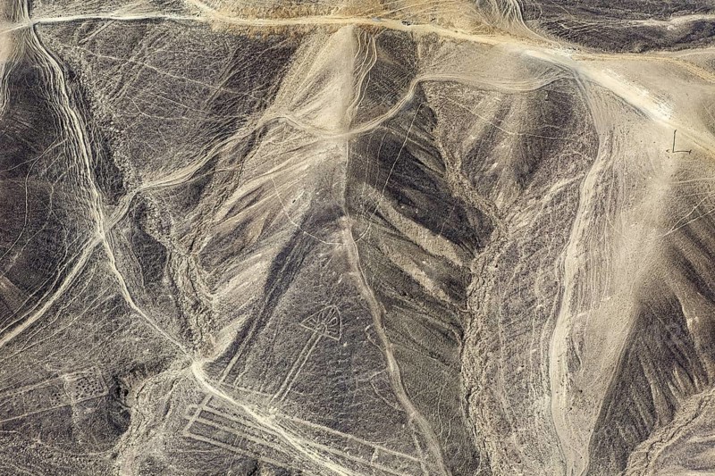 Geoglyphs in the hills of the Nazca Desert with recognizable line structures, The geoglyphs and images in the desert near Nasca and Palpa in Peru