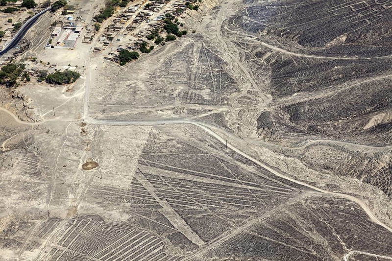 Aerial view of a dry desert landscape with the famous Nazca lines in Peru, the geoglyphs and images in the desert near Nasca and Palpa in Peru