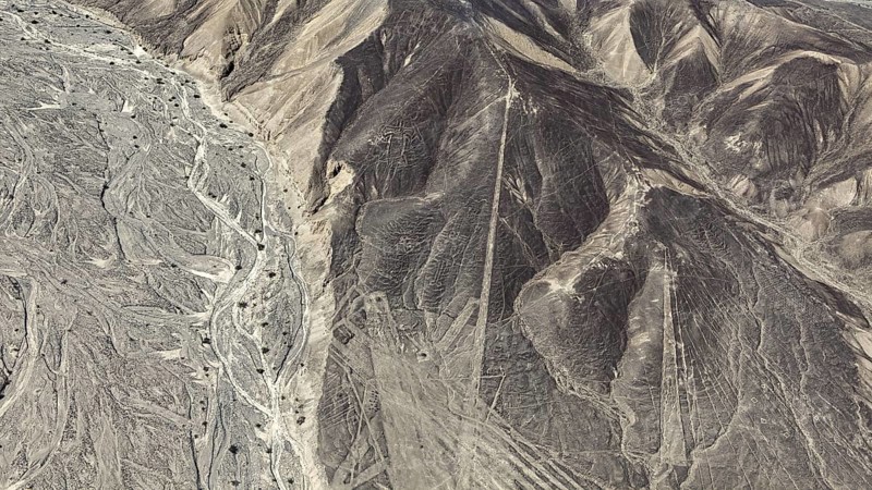 Desert landscape with visible line formations and elevations, the geoglyphs and images in the desert near Nasca and Palpa in Peru