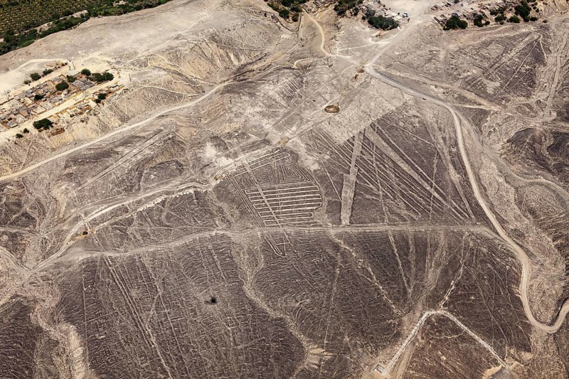 Nazca lines spread across the desert landscape in detailed patterns, the geoglyphs and drawings in the desert near Nasca and Palpa in Peru