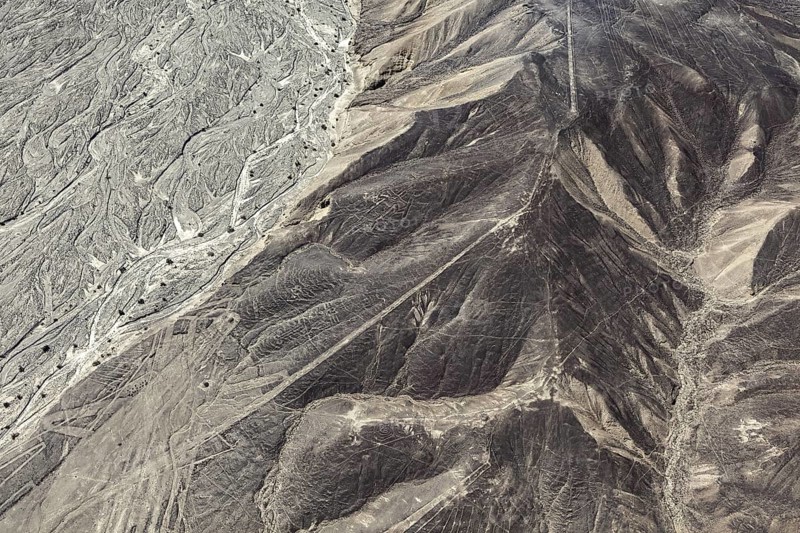 Distinctive desert ridges and line structures viewed from the air, the geoglyphs and images in the desert near Nasca and Palpa in Peru