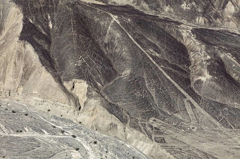Mystery of the Nazca Lines on dry hills, observed from the air, The geoglyphs and images in the desert near Nasca and Palpa in Peru