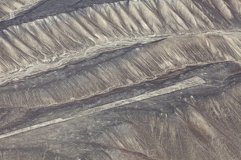 Aerial view of the drawn Nazca lines that cover sandy hills, the geoglyphs and drawings in the desert near Nasca and Palpa in Peru