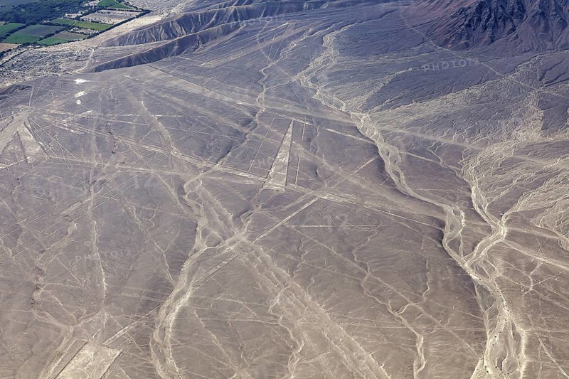 Aerial view of Nazca lines in a dry desert landscape with distinctive geoglyphs, the geoglyphs and images in the desert near Nasca and Palpa in Peru