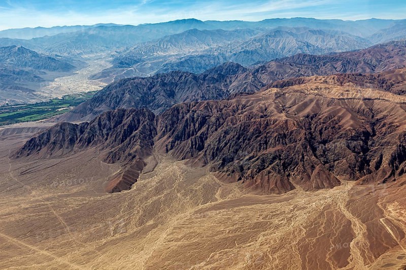 Impressive mountain formations in the midst of an extensive desert landscape from above, the desert landscape near Nasca in Peru