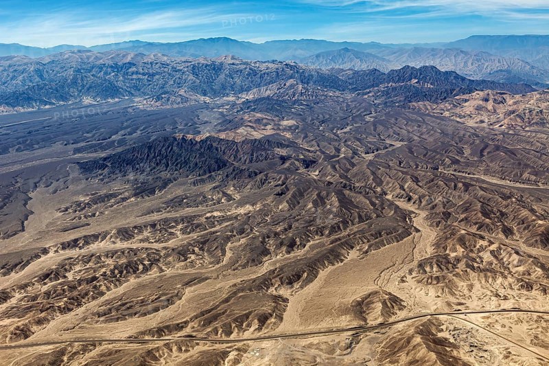 Extensive mountainous desert landscape with barren hills and valleys, the desert landscape near Nasca in Peru