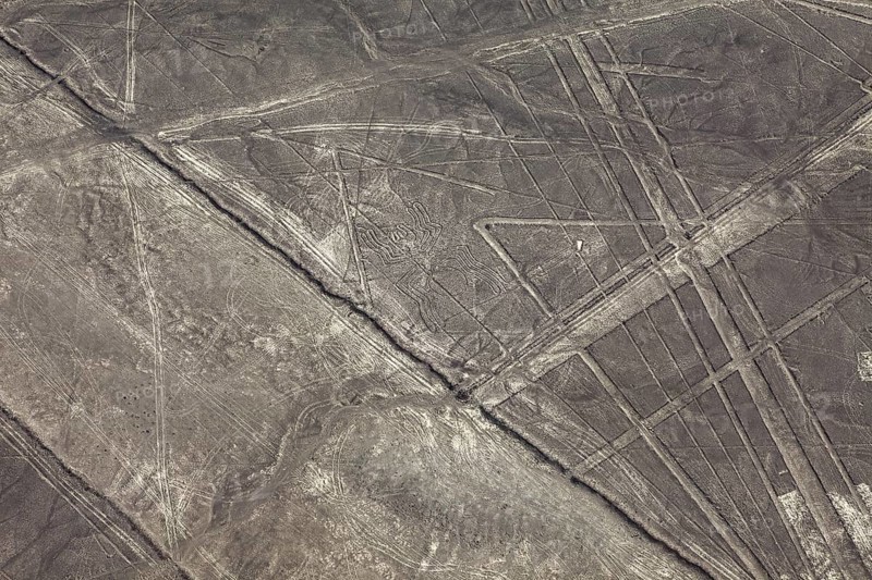Brown exotic landscape with ancient lines and patterns, the geoglyphs and paintings in the desert near Nasca and Palpa in Peru