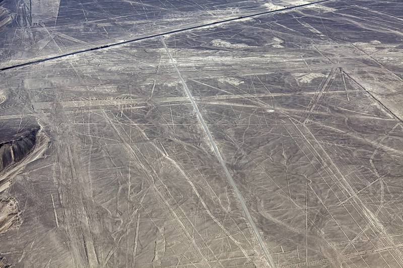 Ancient Nazca lines and patterns on the surface of an extensive desert landscape, the geoglyphs and drawings in the desert near Nasca and Palpa in Peru