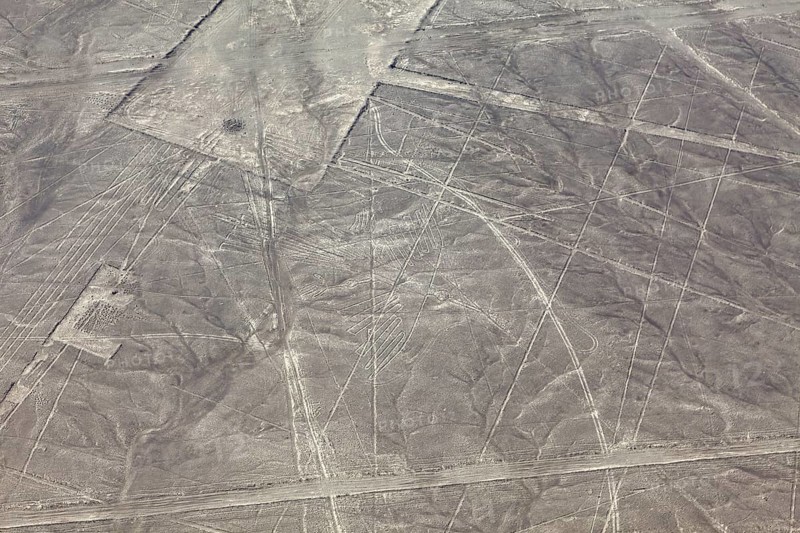 Geometric patterns of the Nazca lines in an arid desert region, seen from the air, The geoglyphs and images in the desert near Nasca and Palpa in Peru