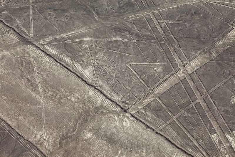 Aerial view of lines and patterns on a dry desert surface, the geoglyphs and drawings in the desert near Nasca and Palpa in Peru